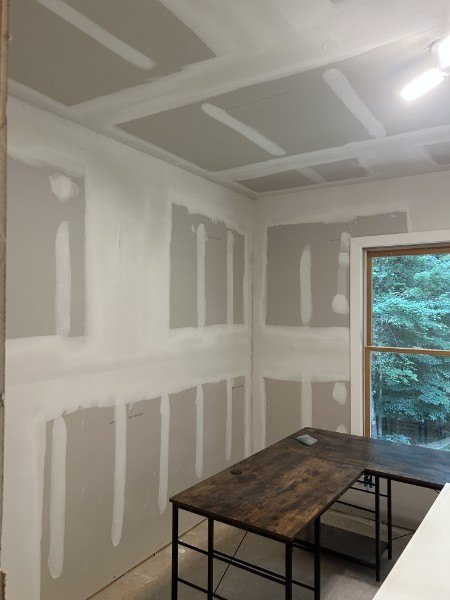 Finished drywall joints on the walls and ceiling, ready for primer