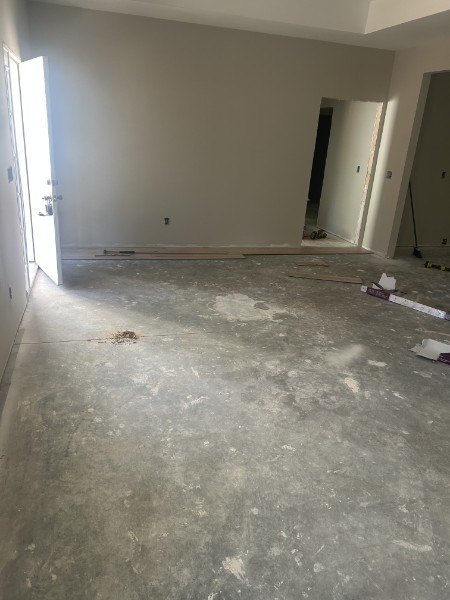 Bare concrete subfloor cleaned and ready for new flooring